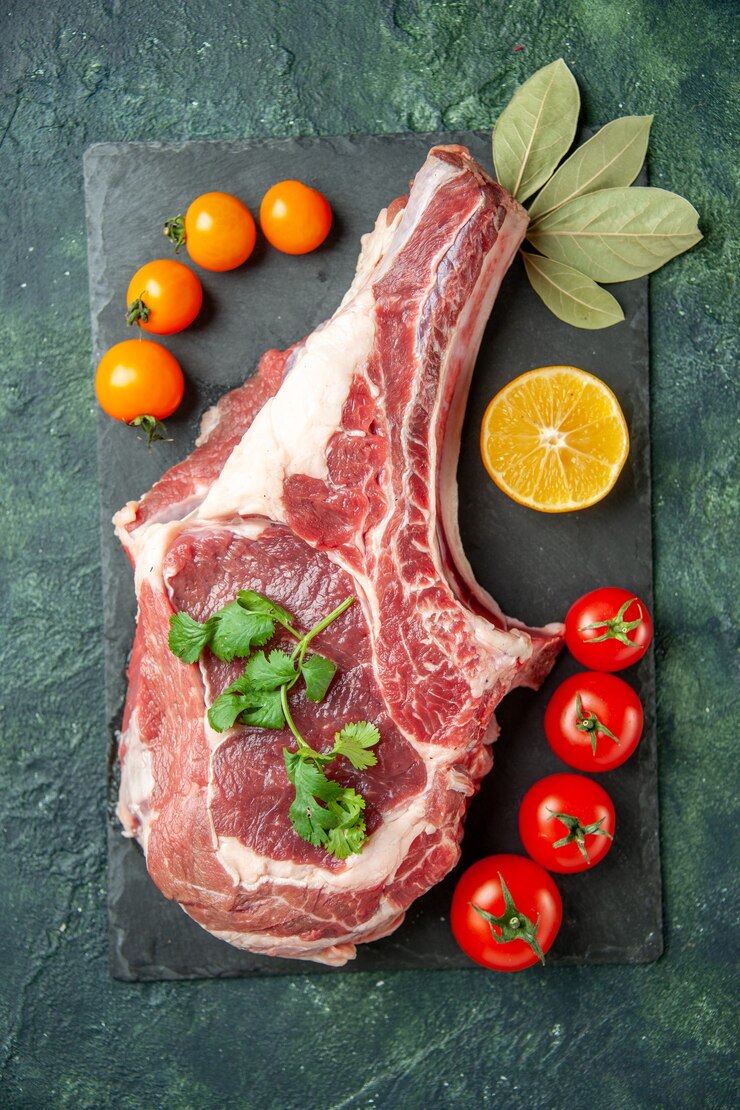 top-view-fresh-meat-slice-with-tomatoes-dark-blue-background-food-meat-kitchen-animal-cow-butcher-chicken-color_179666-46016 top-view-fresh-meat-slice-with-tomatoes-dark-blue-background-food-meat-kitchen-animal-cow-butcher-chicken-color_179666-46016